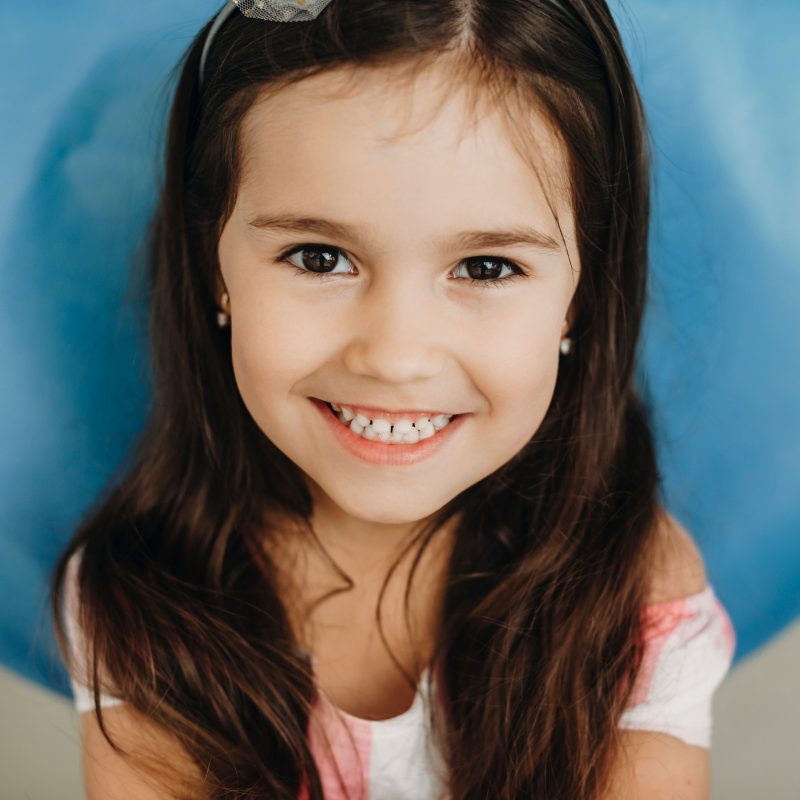 Smiling girl with long brown hair